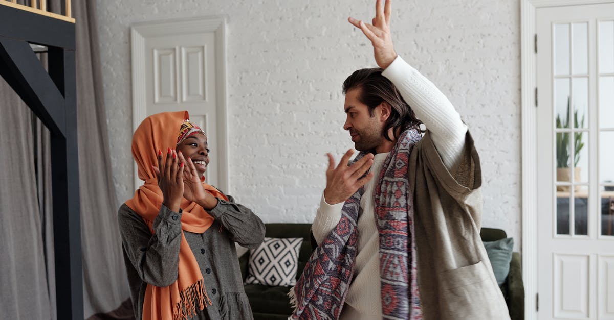 Non-Jewish American Woman Married to Israeli Man Going to Israel - Happy Couple Clapping and Dancing Non-Jewish American Woman Married to Israeli Man Going to Israel - Happy Couple Clapping and Dancing