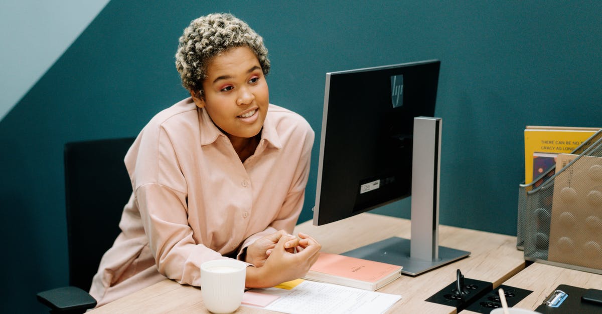 Non-resident alien working for non-US company telecommuting for 10 days under ESTA Visa Waiver [duplicate] - Woman in Pink Dress Shirt Sitting at the Table