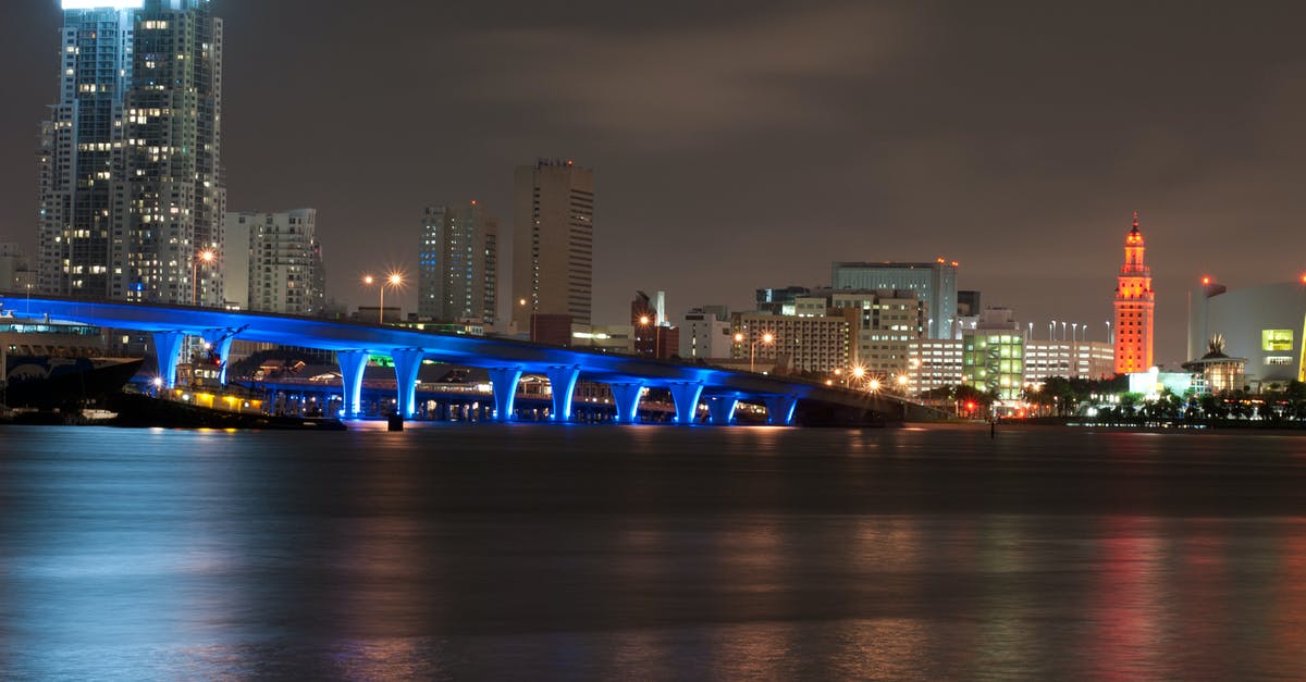 Notifying banks of travel to Florida - Bridge and Urban City at Nighttime Notifying banks of travel to Florida - Bridge and Urban City at Nighttime