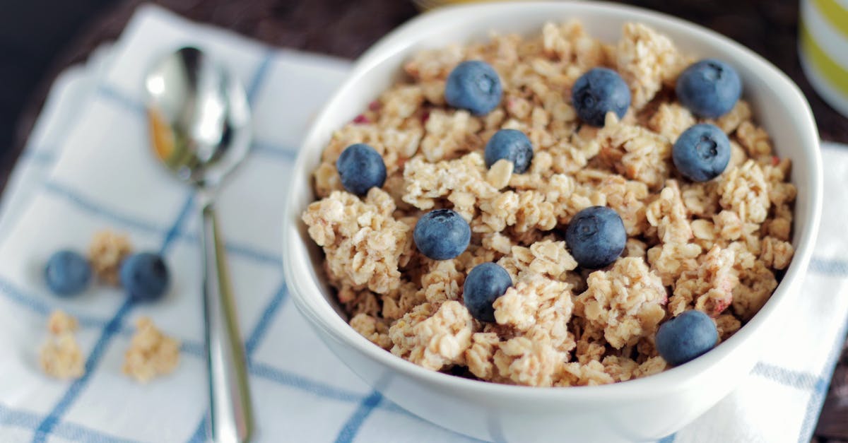 Oat Bran in Sealed Canisters - Bowl of Cooked Foods Beside Spoon Oat Bran in Sealed Canisters - Bowl of Cooked Foods Beside Spoon