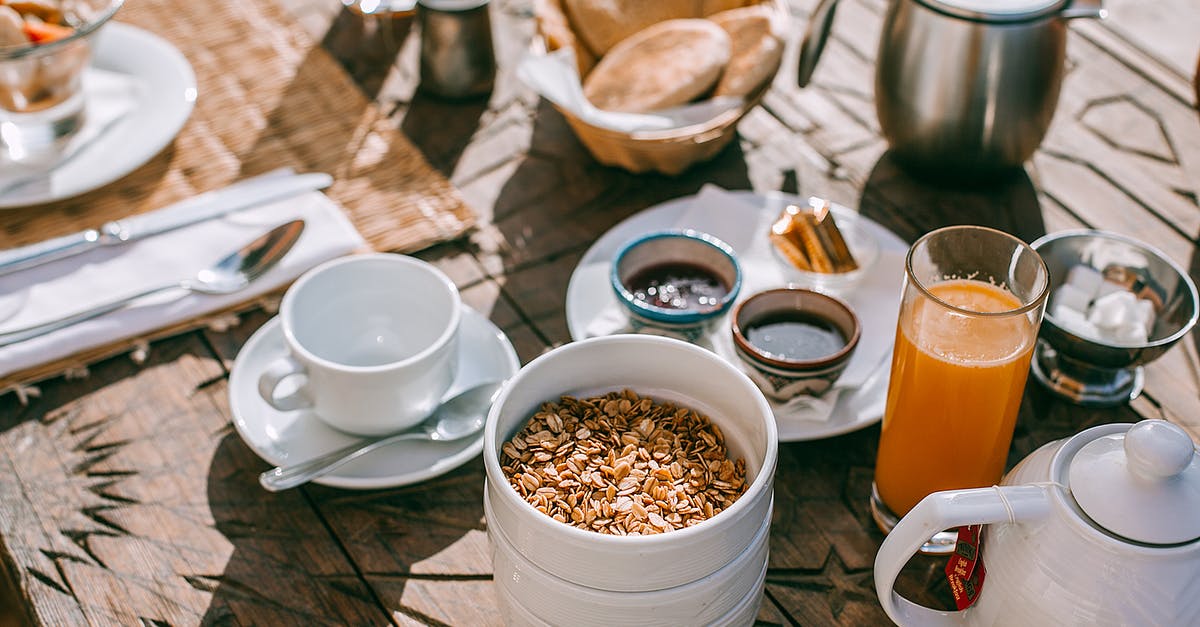 Oat Bran in Sealed Canisters - Served table with breakfast on street Oat Bran in Sealed Canisters - Served table with breakfast on street