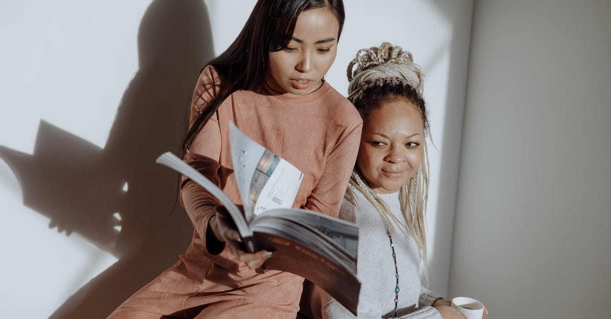 Observation Pages on Passport - Women Having Conversation while Looking at the Magazine Observation Pages on Passport - Women Having Conversation while Looking at the Magazine