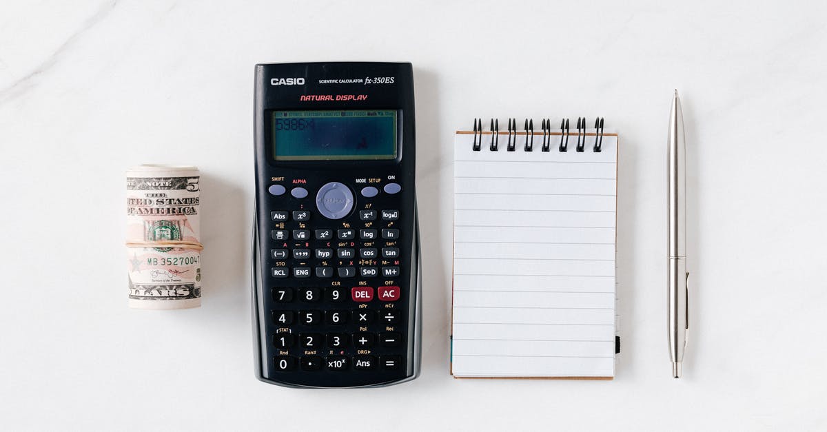 Official COVID vaccination documentation from the USA - Composition of calculator with paper money and notebook with pen Official COVID vaccination documentation from the USA - Composition of calculator with paper money and notebook with pen