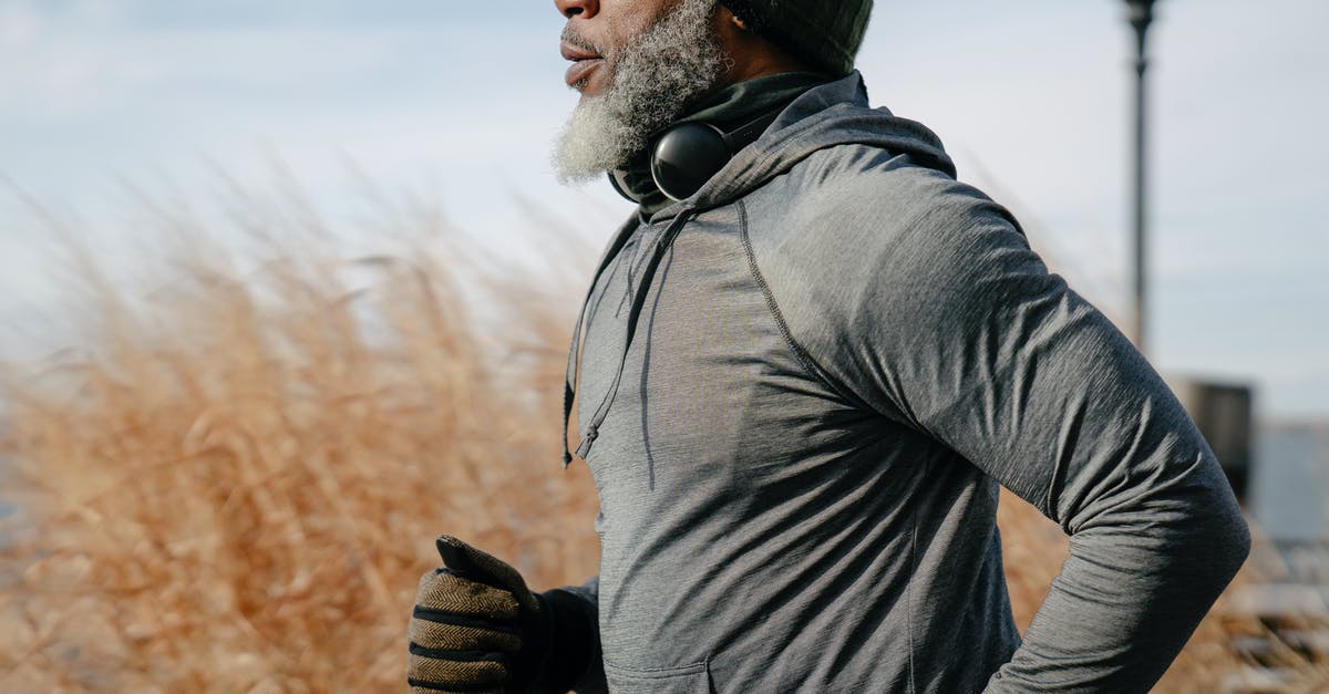 Old passport with Active Visa - Black man in sportswear jogging in sunny autumn day Old passport with Active Visa - Black man in sportswear jogging in sunny autumn day