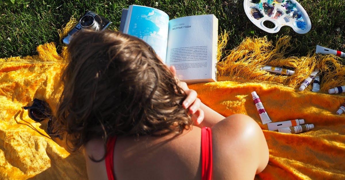 OmegaFlightStore.com, is it reliable to book flights from this site? - A Woman in Red Tank Reading a Book Near the Green Grass OmegaFlightStore.com, is it reliable to book flights from this site? - A Woman in Red Tank Reading a Book Near the Green Grass