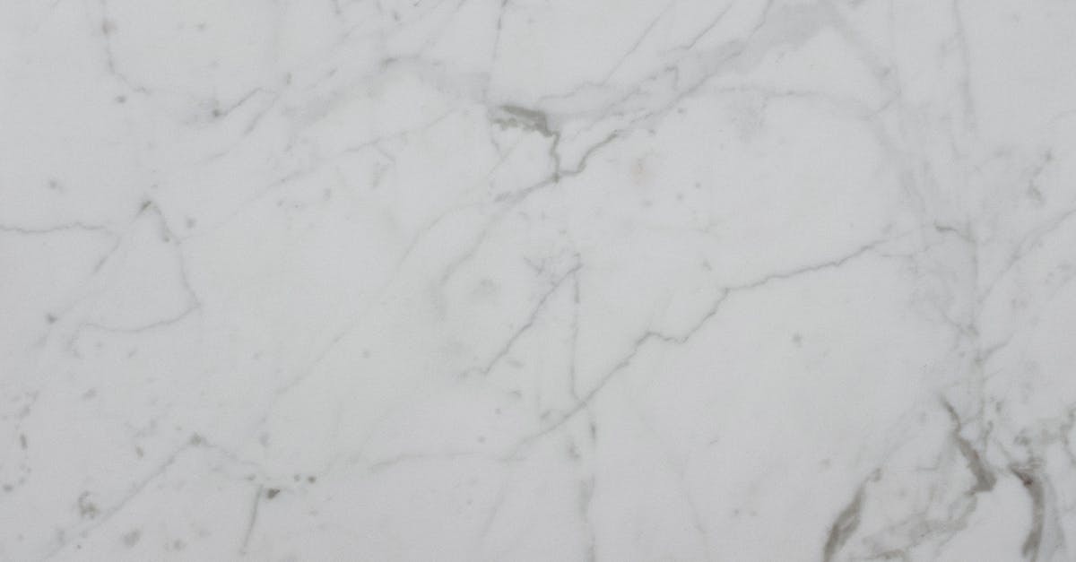 On the Silver Line in Boston - Top view abstract surface background of light gray textured stone slab with dark gray lines of marble pattern on daylight On the Silver Line in Boston - Top view abstract surface background of light gray textured stone slab with dark gray lines of marble pattern on daylight