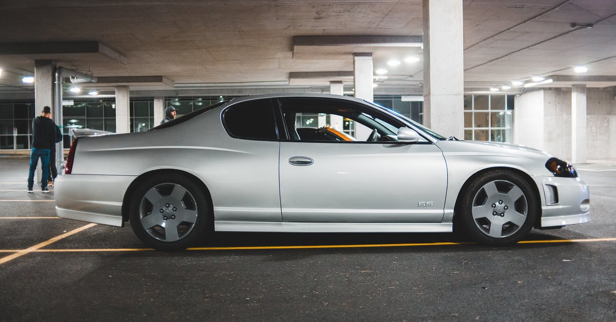 On the Silver Line in Boston - Luxury car on parking lot in city On the Silver Line in Boston - Luxury car on parking lot in city