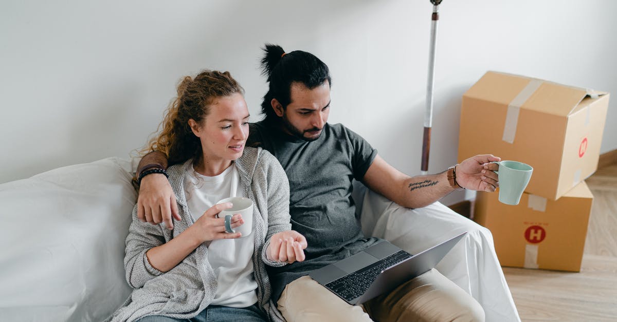On the UK visa application, what should the cost of accommodation be for my wife and son? - Bonding couple browsing laptop after packing carton boxes On the UK visa application, what should the cost of accommodation be for my wife and son? - Bonding couple browsing laptop after packing carton boxes