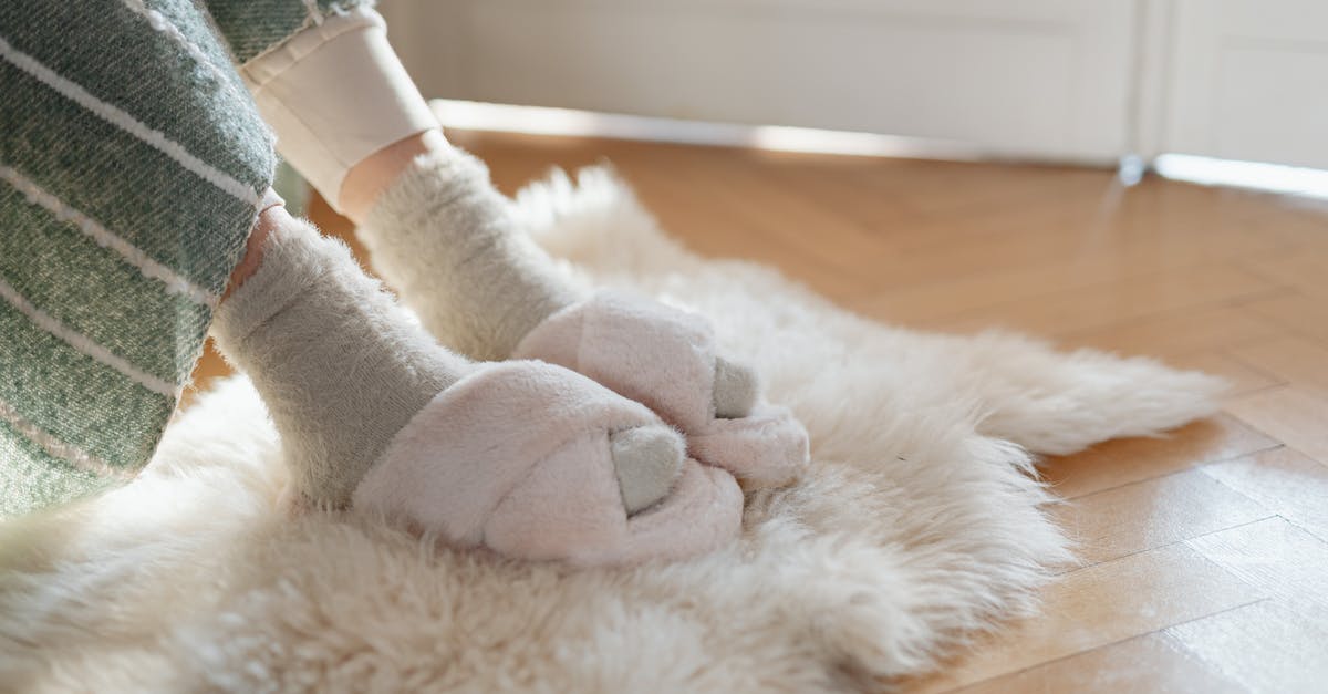 One foot in Belgium and the other in the Netherlands? - Person in Gray and White Sock One foot in Belgium and the other in the Netherlands? - Person in Gray and White Sock