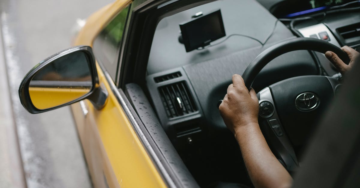 One-Way Car Rental from Yerevan to Tbilisi - Faceless person driving contemporary cab in city One-Way Car Rental from Yerevan to Tbilisi - Faceless person driving contemporary cab in city