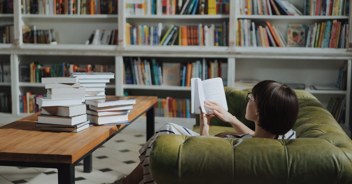 One-way or return ticket for one year study [closed] - Girl Reading Book on Brown Wooden Table