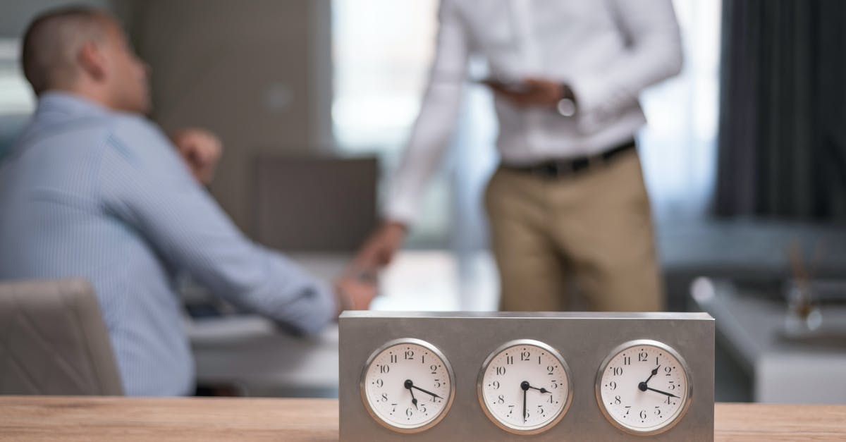 Online resources to deal with Time Zone differences - Man in White Dress Shirt Standing Beside Man in Gray Dress Shirt Online resources to deal with Time Zone differences - Man in White Dress Shirt Standing Beside Man in Gray Dress Shirt