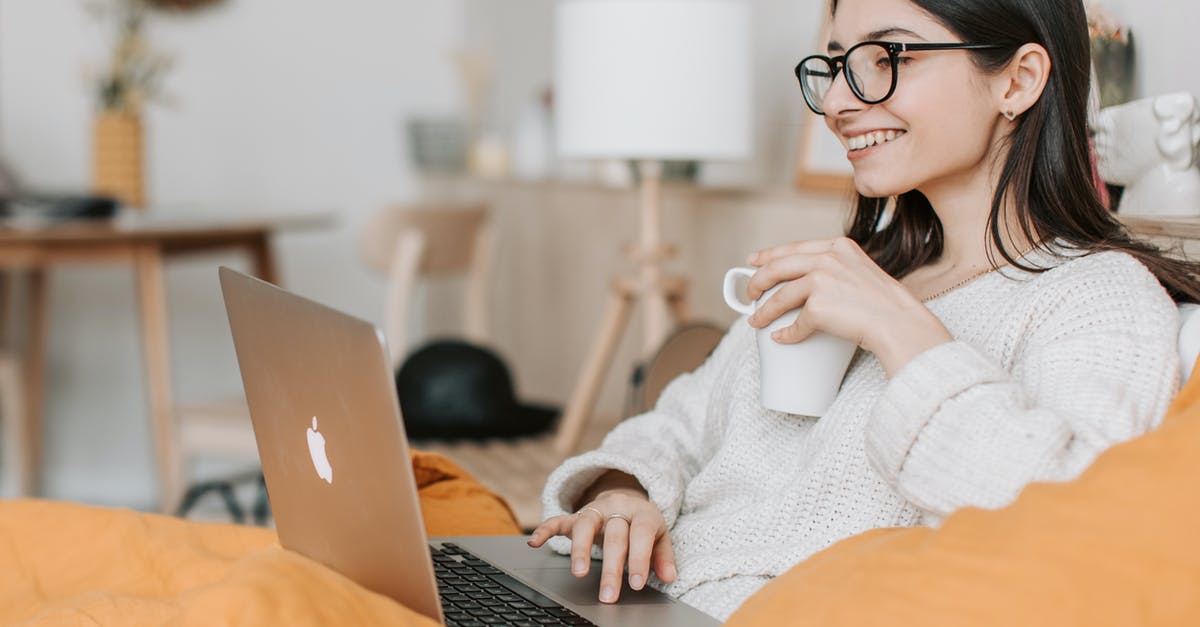Online seat reservations with a JR-Pass - Woman Having Coffee While Using Laptop Online seat reservations with a JR-Pass - Woman Having Coffee While Using Laptop