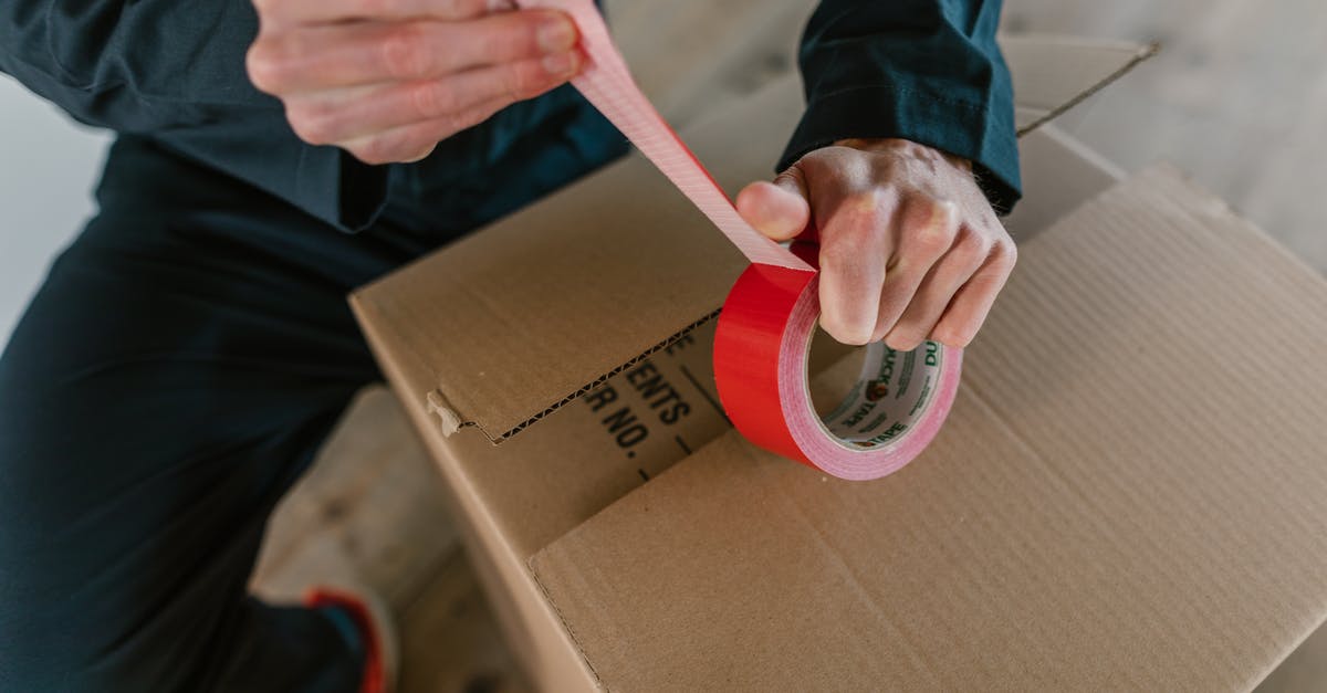 Optimal packing method for bras? - A Person Holding Red Packaging Tape Optimal packing method for bras? - A Person Holding Red Packaging Tape
