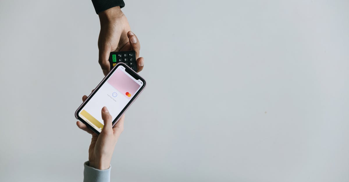 Options for JFK to EWR transfer - A Person Paying using a Smartphone