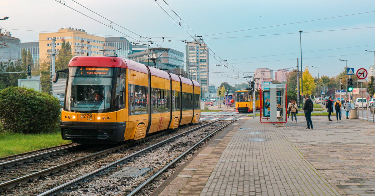 Overcrowded German trains - Yellow Train on Railway Track Overcrowded German trains - Yellow Train on Railway Track