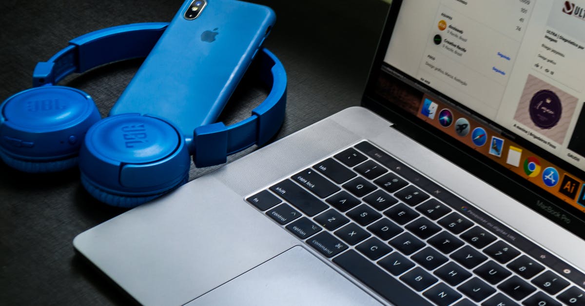 Overnight connection in Guangzhou - where do I sleep? - Macbook Pro Beside Blue Wireless Headphones Overnight connection in Guangzhou - where do I sleep? - Macbook Pro Beside Blue Wireless Headphones