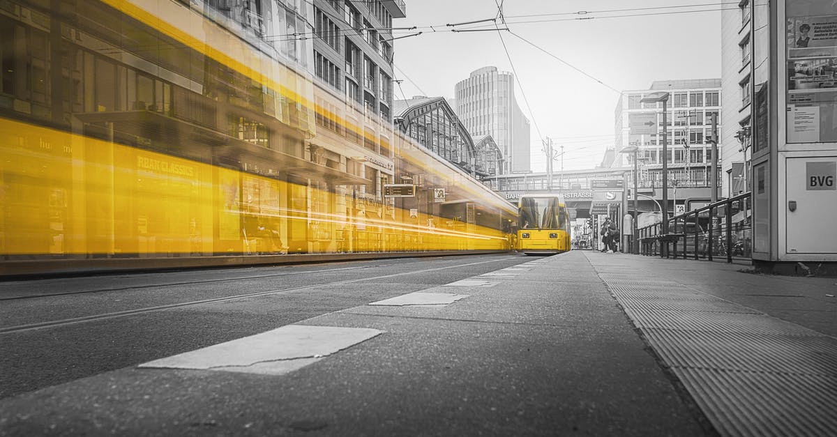 Overnight train: London to Berlin - Selective Color Photography of Yellow Train Beside Building Overnight train: London to Berlin - Selective Color Photography of Yellow Train Beside Building