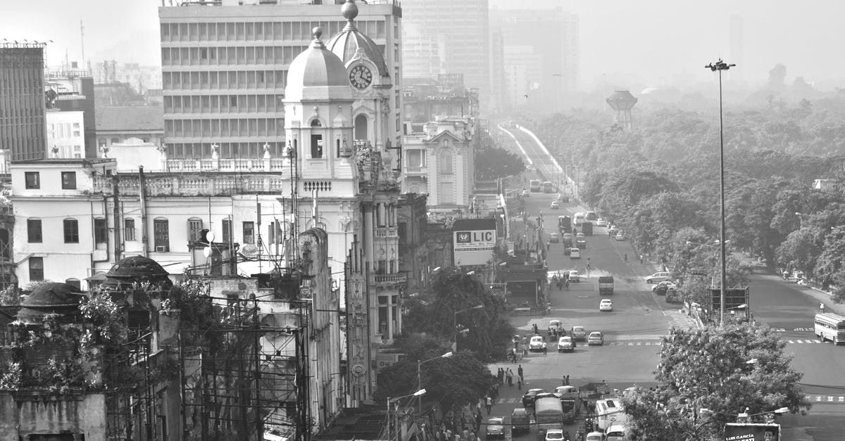 Overstay In India - Grayscale Photo of City Buildings Overstay In India - Grayscale Photo of City Buildings