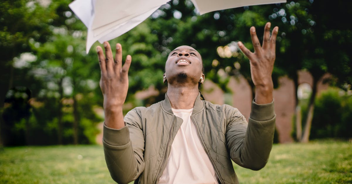 Overstayed in Canada for three months, will this affect student visa application to the UK? [closed] - Content black remote worker throwing work papers in air happy to get rid of boring paperwork while sitting in green park with laptop
