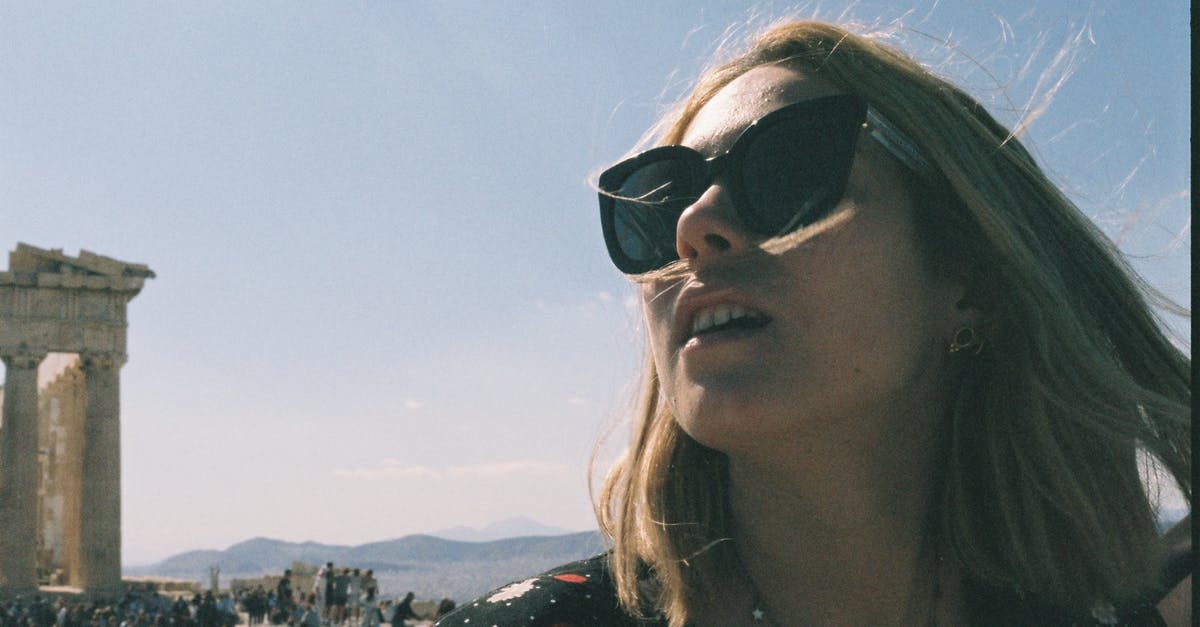 Overstayed in Greece earlier. How can I return now? [closed] - Woman in Black and Red Floral Shirt Wearing Black Sunglasses