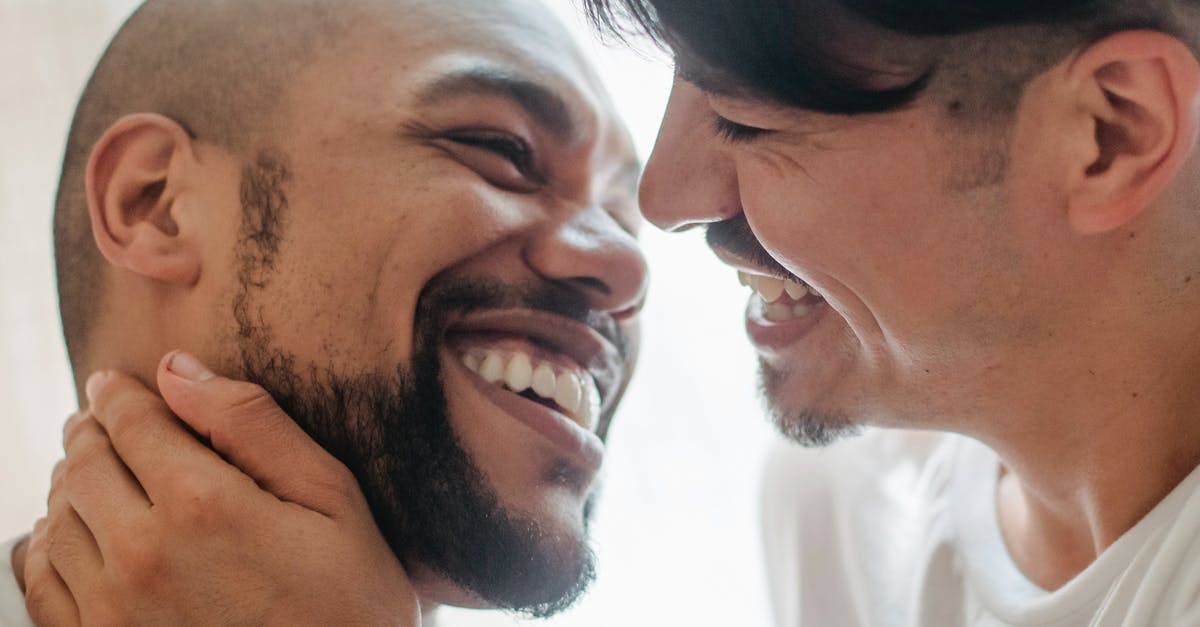 Overstayed in the Philippines for over 2 years but I want to stay here permanently [closed] - Two Smiling Men Want Kiss