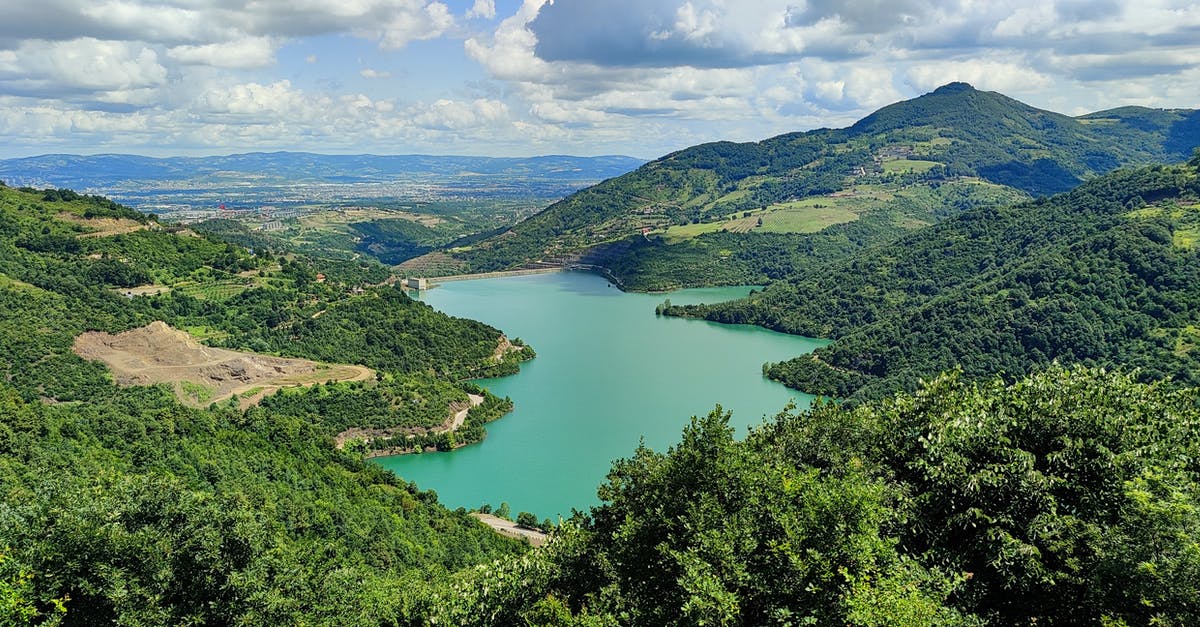 Overstayed in Turkey - Green Lake Surrounded by Green Trees Under Blue Sky Overstayed in Turkey - Green Lake Surrounded by Green Trees Under Blue Sky