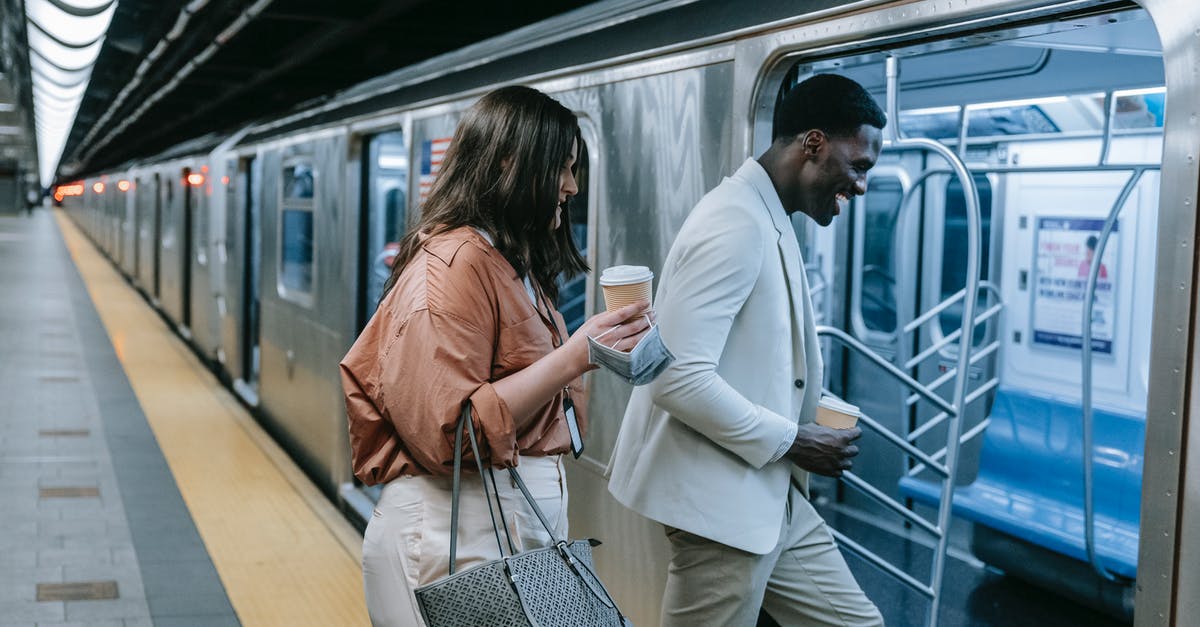 Overstayed Schengen Visa, how long to wait before entering again? - A Man and Woman Entering the Train while Having Conversation Overstayed Schengen Visa, how long to wait before entering again? - A Man and Woman Entering the Train while Having Conversation