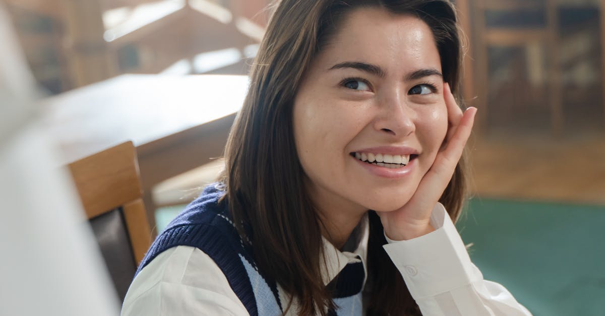 Overstayed Student Visa for 2 years in Canada, almost 8years ago [closed] - Woman in Blue and White Long Sleeve Shirt Smiling