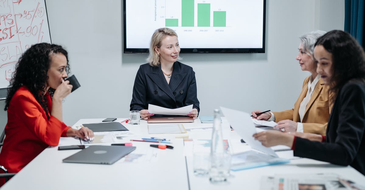 Overstaying and documents - Woman in Black Blazer Sitting at the Table Overstaying and documents - Woman in Black Blazer Sitting at the Table