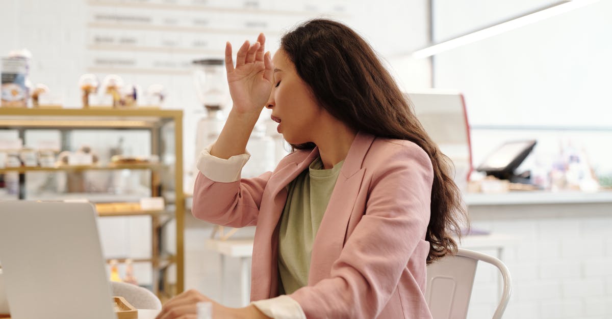 Overstaying Schengen visa due to Covid-19 infection: What are the consequences? - A Woman Sneezing while Working on Her Laptop Overstaying Schengen visa due to Covid-19 infection: What are the consequences? - A Woman Sneezing while Working on Her Laptop
