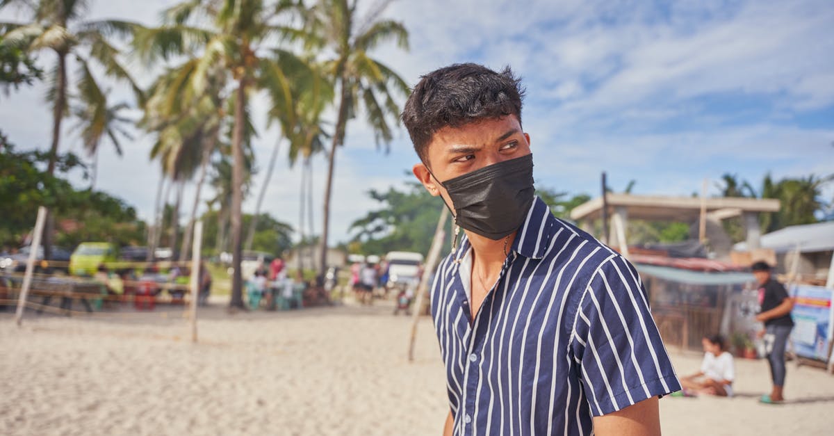 Overstaying Ukrainian visa due to Coronavirus - Man Wearing a Black Face Mask Overstaying Ukrainian visa due to Coronavirus - Man Wearing a Black Face Mask