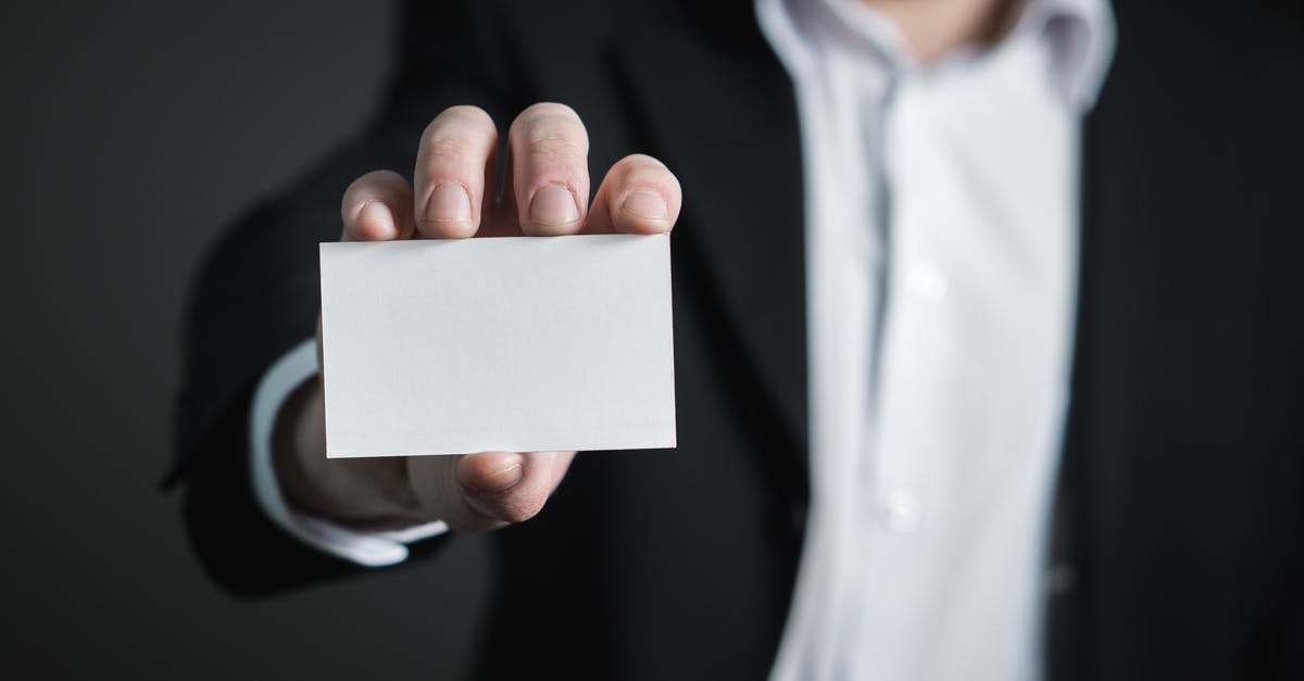 Oyster Card - how does it actually work? - Close-up of Hand Holding Text over Black Background