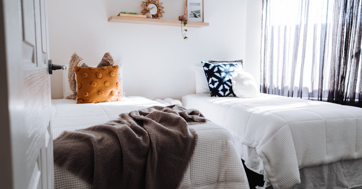 Paid hotel as condition for getting visa? - Separate beds in bedroom in sunlight Paid hotel as condition for getting visa? - Separate beds in bedroom in sunlight