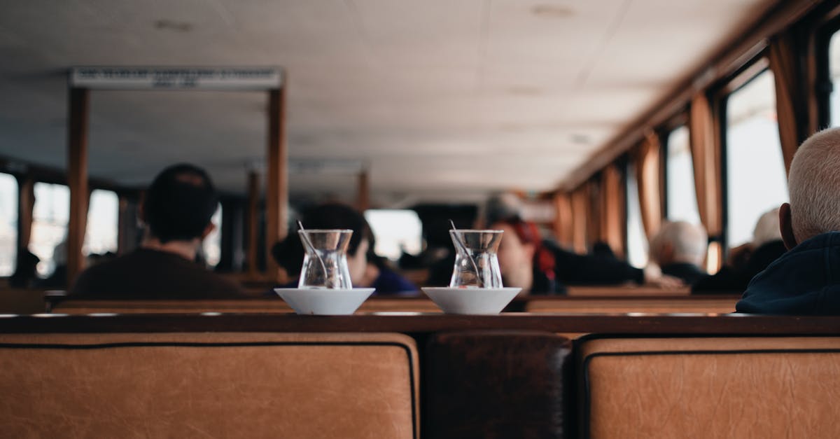 Parcel shelves in small hire cars in the US - Small Middle East tea glass on ceramic saucers placed on wooden shelf in cozy cafe Parcel shelves in small hire cars in the US - Small Middle East tea glass on ceramic saucers placed on wooden shelf in cozy cafe