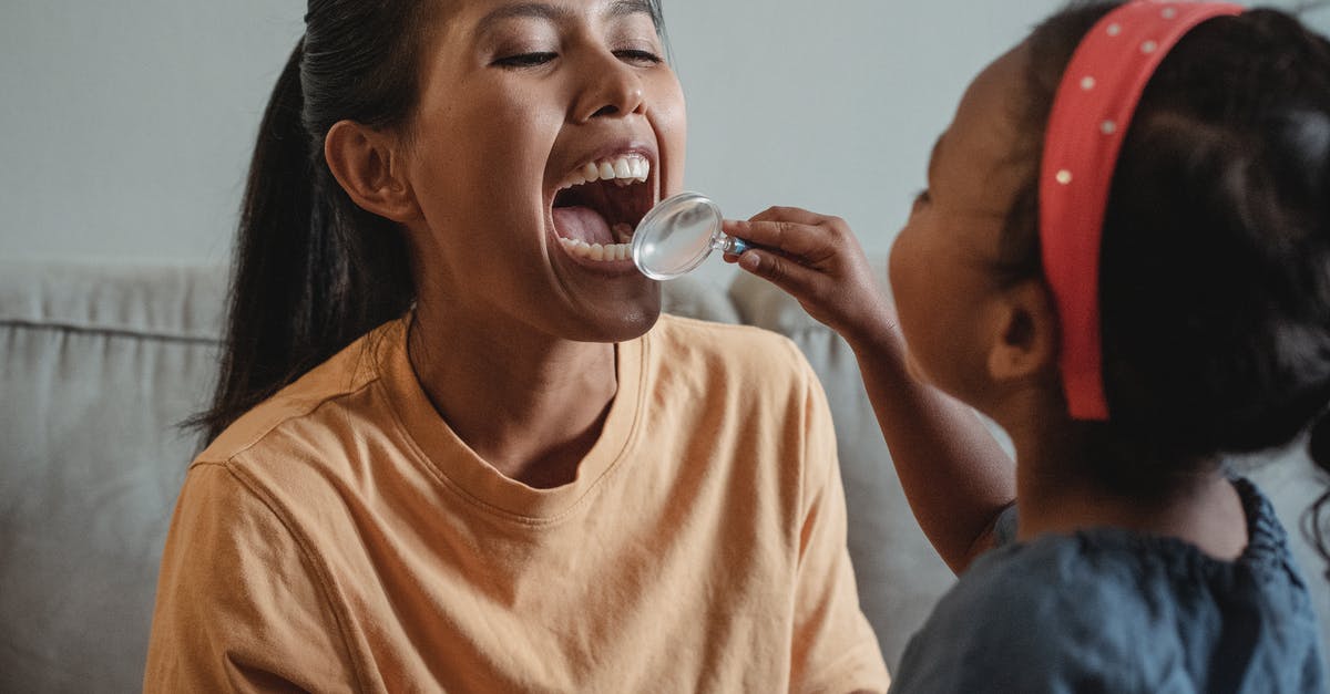 Parents going though medical issues and possibility of expediting I-130 - Crop Asian mother and daughter playing dentist game together Parents going though medical issues and possibility of expediting I-130 - Crop Asian mother and daughter playing dentist game together