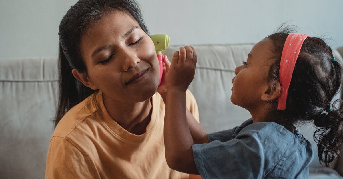 Parents going though medical issues and possibility of expediting I-130 - Asian mother with closed eyes playing with daughter in apartment Parents going though medical issues and possibility of expediting I-130 - Asian mother with closed eyes playing with daughter in apartment