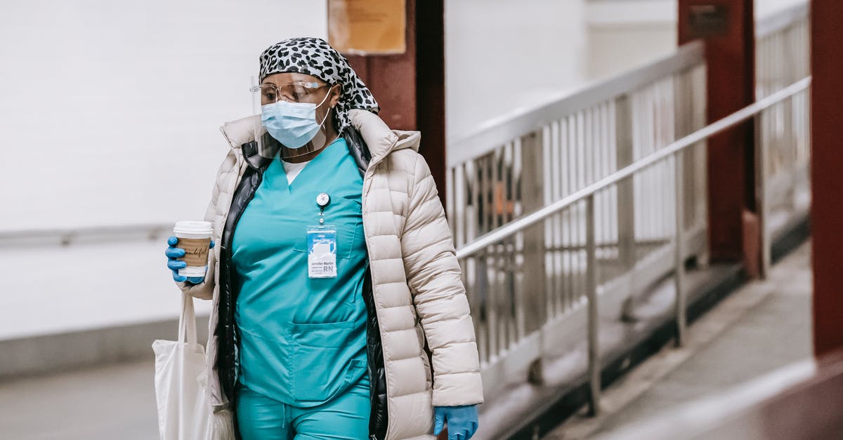 Parents going though medical issues and possibility of expediting I-130 - Black female nurse in uniform and protective mask on street Parents going though medical issues and possibility of expediting I-130 - Black female nurse in uniform and protective mask on street