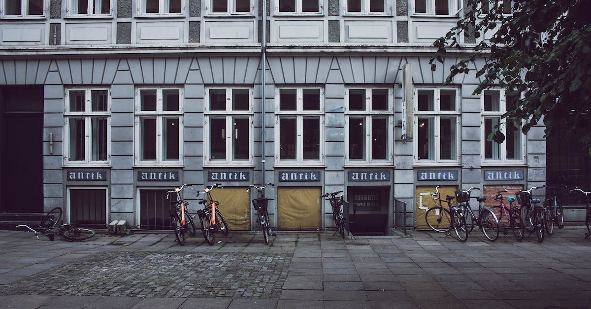 Parking in Copenhagen - Bicycles Parked in Front of Building Parking in Copenhagen - Bicycles Parked in Front of Building