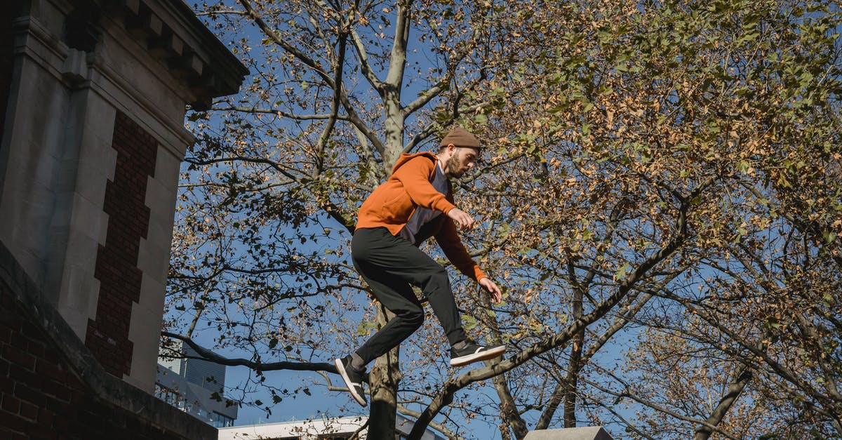 Parkour - Tricking - Free-running in Tokyo? - Active male tracer jumping above brick building staircase Parkour - Tricking - Free-running in Tokyo? - Active male tracer jumping above brick building staircase
