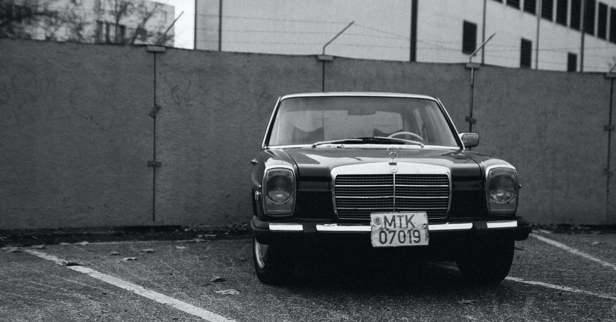 Passing border in car not owned by me - Black Vehicle Parked Near Concrete Wall in Grayscale Photography Passing border in car not owned by me - Black Vehicle Parked Near Concrete Wall in Grayscale Photography