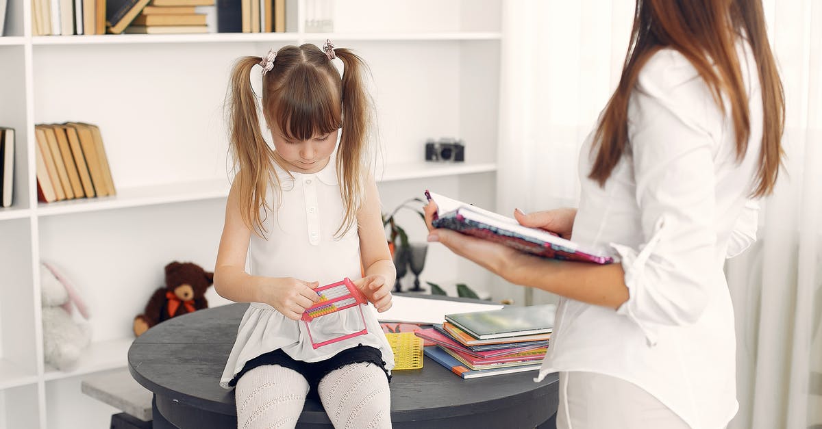 Passport Expiry for my kids less than a month and travelling Home country - Little child in white dress using abacus for mental arithmetic while sitting on black round table with textbooks and school items against bookshelf during home education with crop young female tutor standing near with diary in hands Passport Expiry for my kids less than a month and travelling Home country - Little child in white dress using abacus for mental arithmetic while sitting on black round table with textbooks and school items against bookshelf during home education with crop young female tutor standing near with diary in hands
