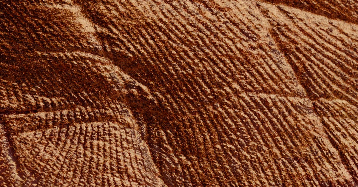 Passport outer cover with slight damage - Closeup of abstract rough textured parget surface of brown color with cracks Passport outer cover with slight damage - Closeup of abstract rough textured parget surface of brown color with cracks