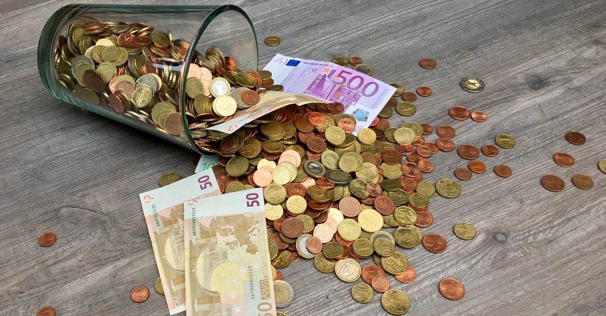 Paying with Euro in Czech Republic - Coins and Banknotes Scattered on Gray Wooden Surface Paying with Euro in Czech Republic - Coins and Banknotes Scattered on Gray Wooden Surface