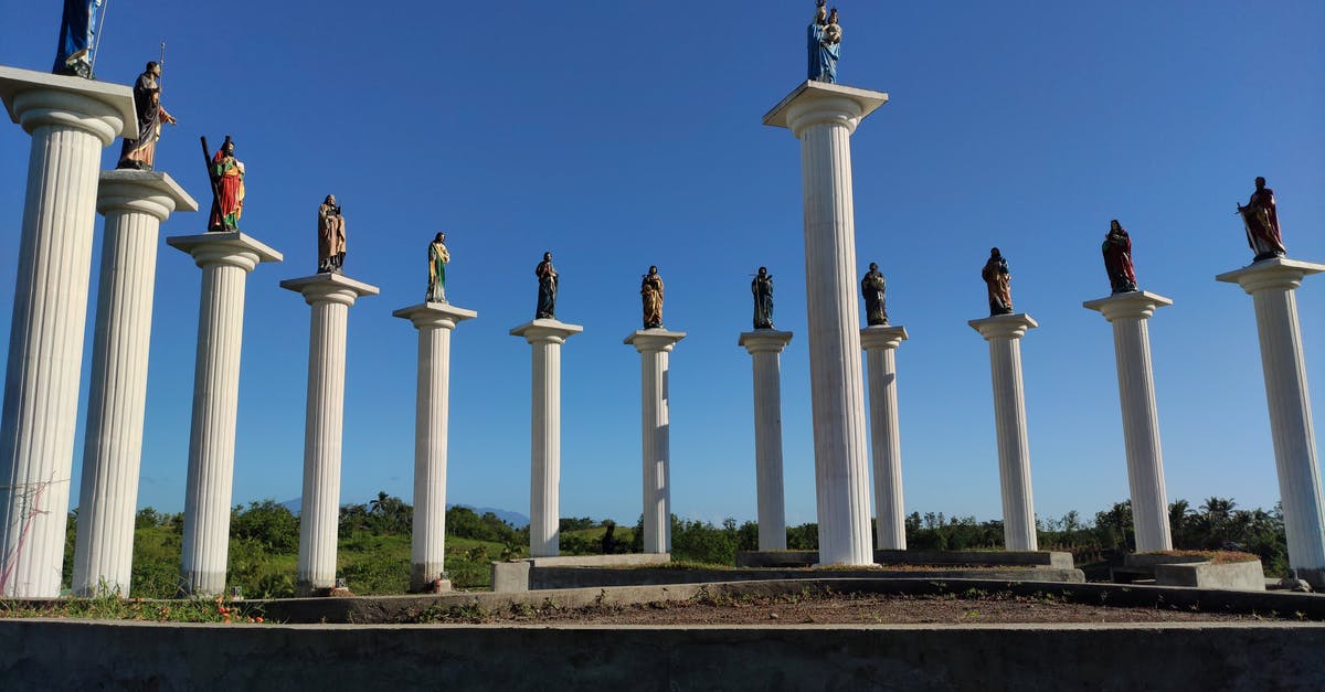 Pending Government Approval, flights being cancelled into Mexico - White Concrete Pillar Under Blue Sky