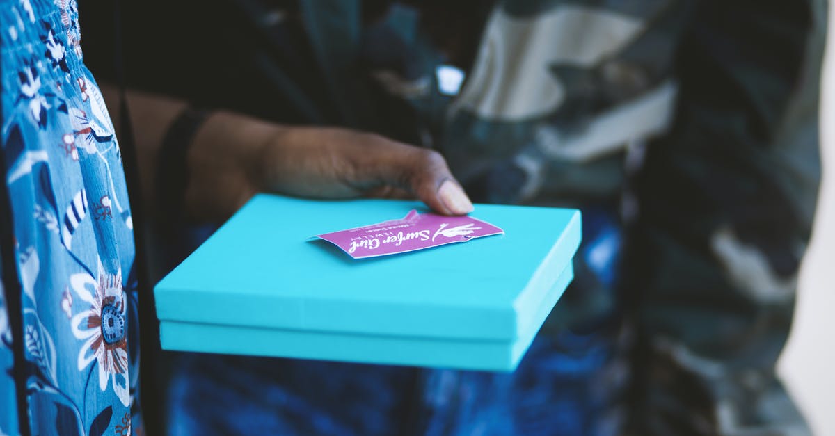 Personal vacation/Tourism on EU blue card - Person Holding Blue Box Personal vacation/Tourism on EU blue card - Person Holding Blue Box