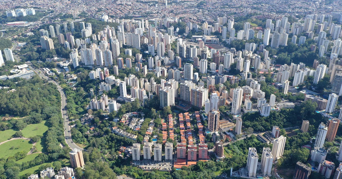 Peru: Can I reserve the hostels on the same day I arrive in a new city? - Drone view of spectacular developed city with tall houses and roads on sunny clear day Peru: Can I reserve the hostels on the same day I arrive in a new city? - Drone view of spectacular developed city with tall houses and roads on sunny clear day