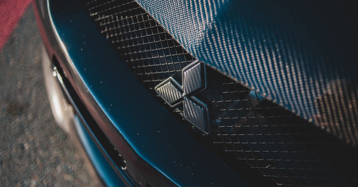 Philadelphia to Cape May - Route 55 or Atlantic City Expressway [closed] - Closeup of metal lattice with nameplate between hood and bumper on luxury car on road