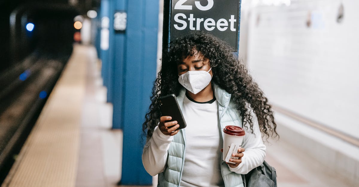 Phone dying when using mobile myTix NJ Transit app - what can be done to protect? - Focused black woman using smartphone on metro platform Phone dying when using mobile myTix NJ Transit app - what can be done to protect? - Focused black woman using smartphone on metro platform