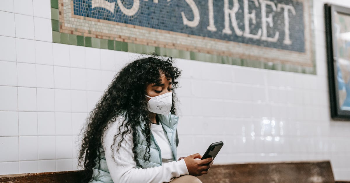 Phone dying when using mobile myTix NJ Transit app - what can be done to protect? - Focused black woman using smartphone in underground station Phone dying when using mobile myTix NJ Transit app - what can be done to protect? - Focused black woman using smartphone in underground station